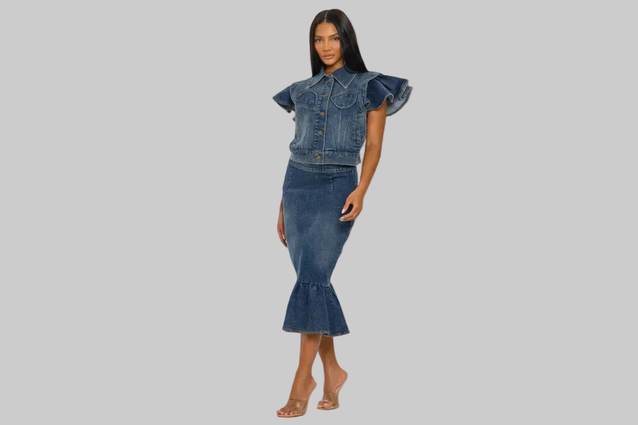 Woman wearing a denim outfit with a gray background